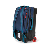 General shot of backpack straps on Topo Designs Global Travel Bag Roller durable carry-on convertible laptop rolling suitcase in Navy blue.