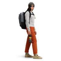Model wearing Topo Designs Women's Global Sweater recycled Italian wool crewneck pullover in "gray"