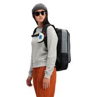 Model wearing Topo Designs Women's Global Sweater recycled Italian wool crewneck pullover in "gray"